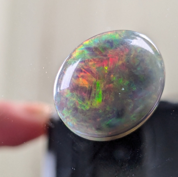 5.85ct Natural play of color black opal - Picture 9 of 16